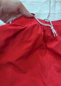 Red Track Pants with White Stripes