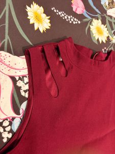 Chic Burgundy Sleeveless Top with Gold Accent