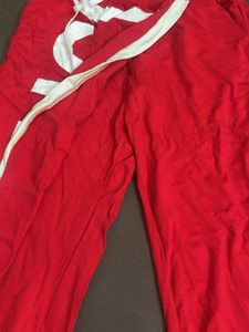 Red Wide-Leg Pants with Bold White Text