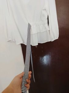 Chic White Peplum Top with Bow Accent