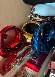 Unique Gold Sphere, red and blue clutch