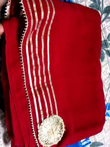 Elegant Red Saree with Gold Embellishments
