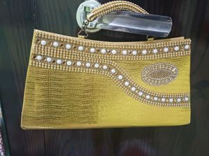 Elegant Gold Embellished Clutch Bag