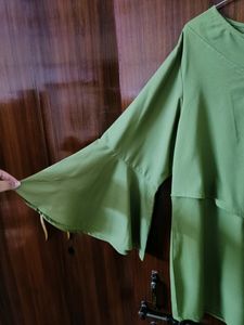 This is a Beautiful green colour Top... It's so fashionable as you can see in the picture... It's real price is also mentioned... I bought it resently... from Mintra....