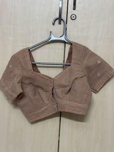 pastel pink blouse
