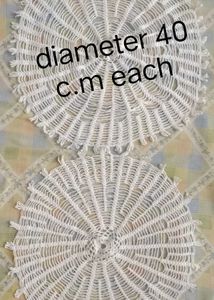white crochet table cover knitted by thread