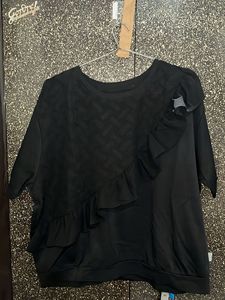 Stylish Black Top with Ruffle Detail