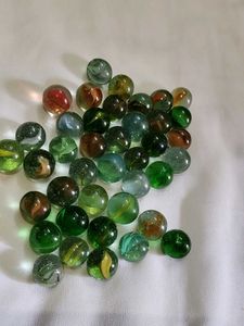 40 pieces colourful shiny glass marbles.