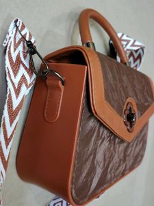 Chic Brown Handbag with Trendy Strap