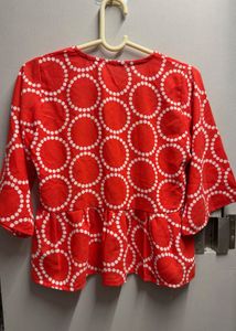 Vibrant Red Peplum Top with Circles