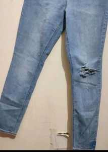 Light Wash Ripped Button Fly Jeans