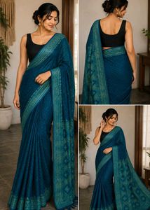 Elegant Teal Saree with Intricate Gold Border