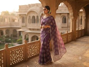 Elegant Purple Saree with Intricate Print