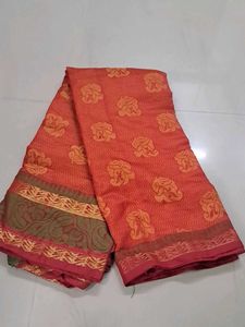 Elegant Orange Saree with Floral Motifs