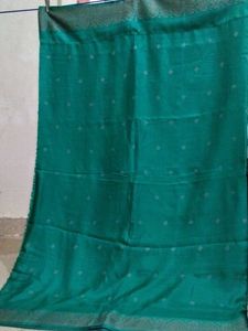 Elegant Teal Saree with Subtle Motifs
