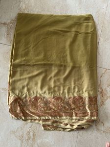 Elegant Golden Saree with Paisley Border