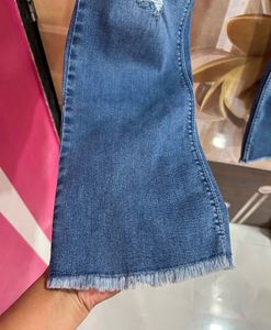 Distressed Blue Denim Jeans
