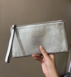Michael Kors metallic wristlet bag