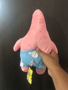 pink Patrick Star plush toy wearing his signature