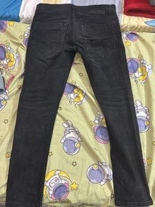 Faded black jeans