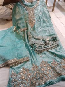 Exquisite Teal Kurta Set with Intricate Embellishm
