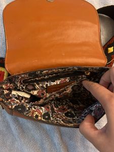 Stylish Brown Crossbody Bag with Embellished Strap