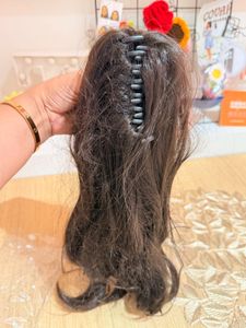 Hair extensions with attached claw