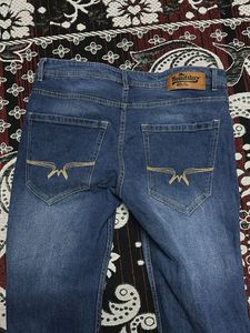 Distressed Blue Denim Jeans