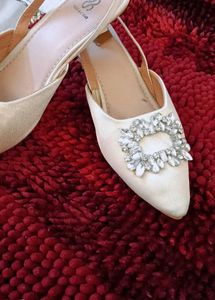 17. Elegant White Slingback Heels