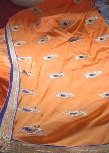 Orange Saree with Blue Velvet Blouse