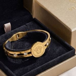 Gold Tone Medusa Medallion Bangle Bracelet