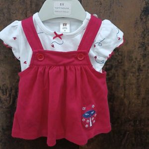 red and white dungree style frock.for newborn girls. wore only once. recently purchased