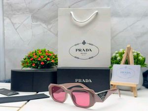 Prada Sunglasses - Chic Pink Tinted Lenses