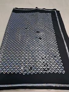 Elegant Black Saree with Silver Embellishments