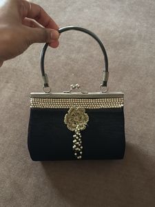 Elegant Black Clutch with Pearl Embellishment