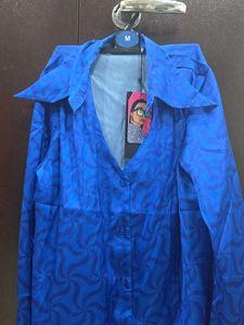 Vibrant Blue Button-Up Blouse with Geometric Patte
