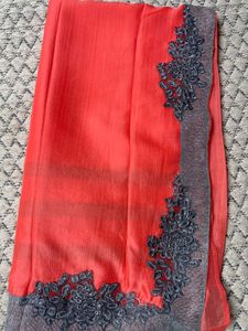 Vibrant Coral Saree with Embellished Border