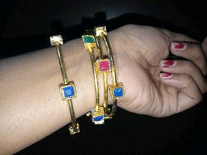set of 2 Gold Toned Bangles with Gemstones