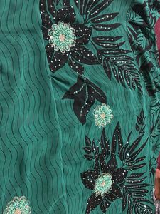 Elegant Green Saree with Black Floral Print