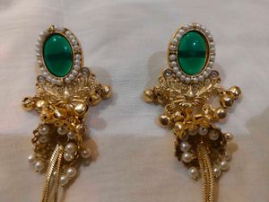 Exquisite Gold Jhumka Earrings with Green Stone