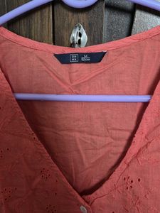 Coral Eyelet Peplum Top