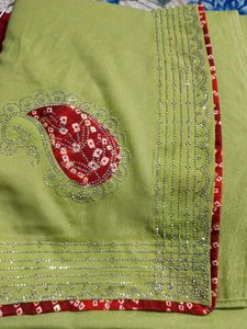 Elegant Lime Green Saree with Red Bandhani Border