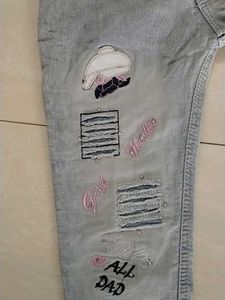 Light Wash Distressed Jeans with Patches