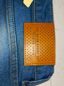 Stylish Men's Ripped Blue Jeans branded with tag