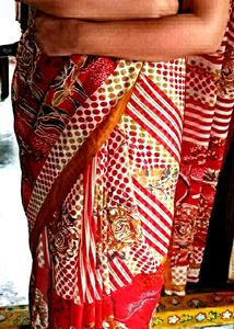 "Crimson Blooms: A Red Floral Print Saree 🌹🌼💃"