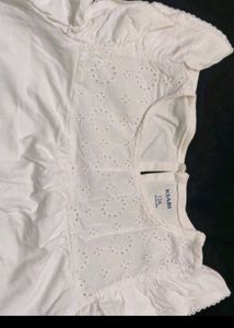 White eyelet detail top