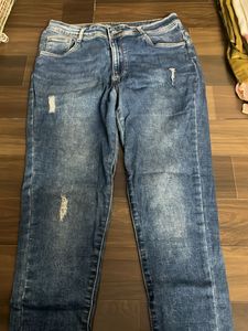 Distressed Blue Denim Jeans