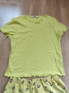 Only brand top with cute yellow shorts.