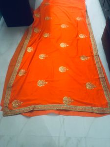 beautiful golden embroidery border orange saree