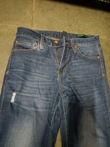 Distressed Blue Denim Jeans